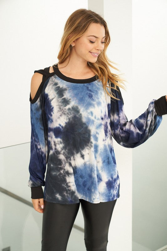 A long sleeve tie dye knit top with a round neck featuring a puff sleeve and a cut out detail. Fabric is soft and comfortable.