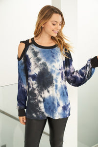 A long sleeve tie dye knit top with a round neck featuring a puff sleeve and a cut out detail. Fabric is soft and comfortable.
