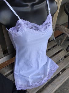 Fitted spaghetti strap top with lace detail. Junior Size. Black and white in color