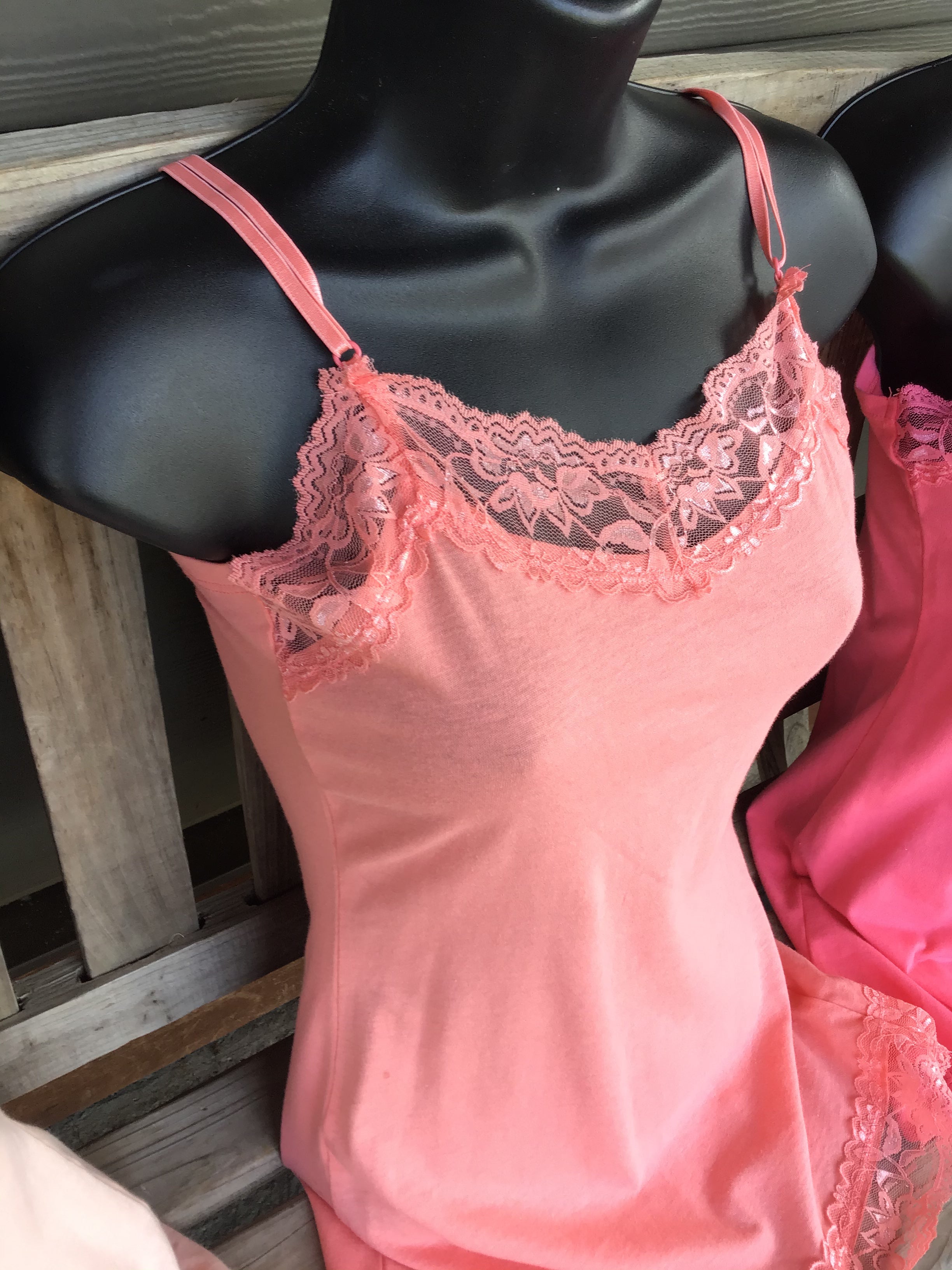 Fitted spaghetti strap top with lace detail. Junior Size. Colours soft peach coral and vibrant