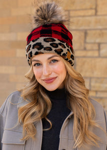 Fleece lined leopard and red plaid hat faux fur pom pom accent