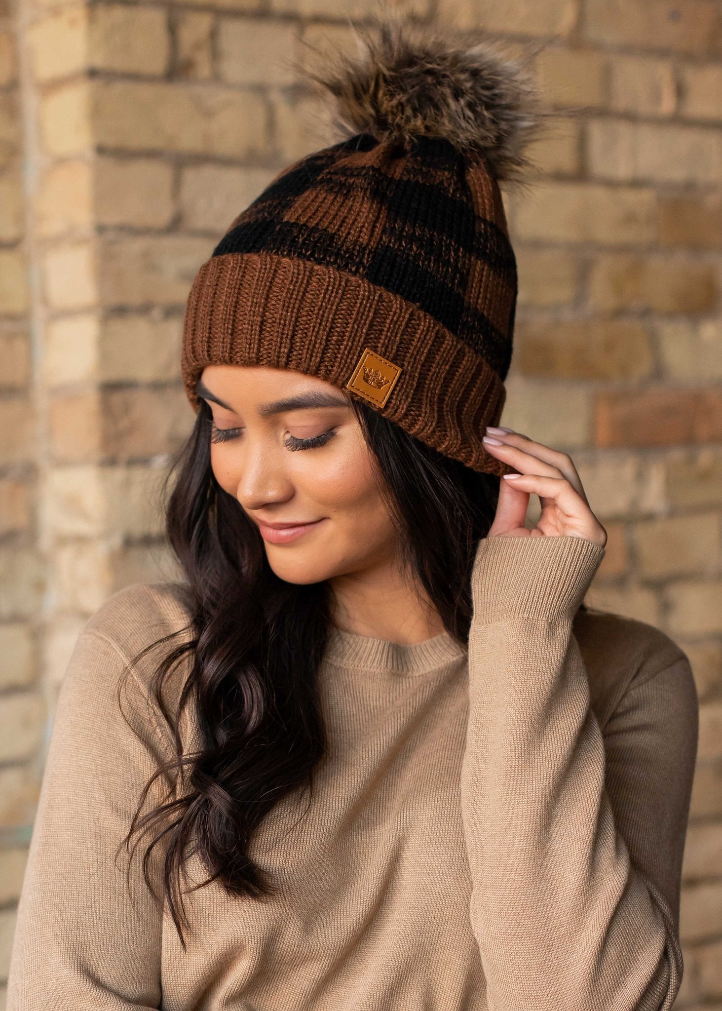 Brown and black buffalo plaid fleece lined knit hat pom pom