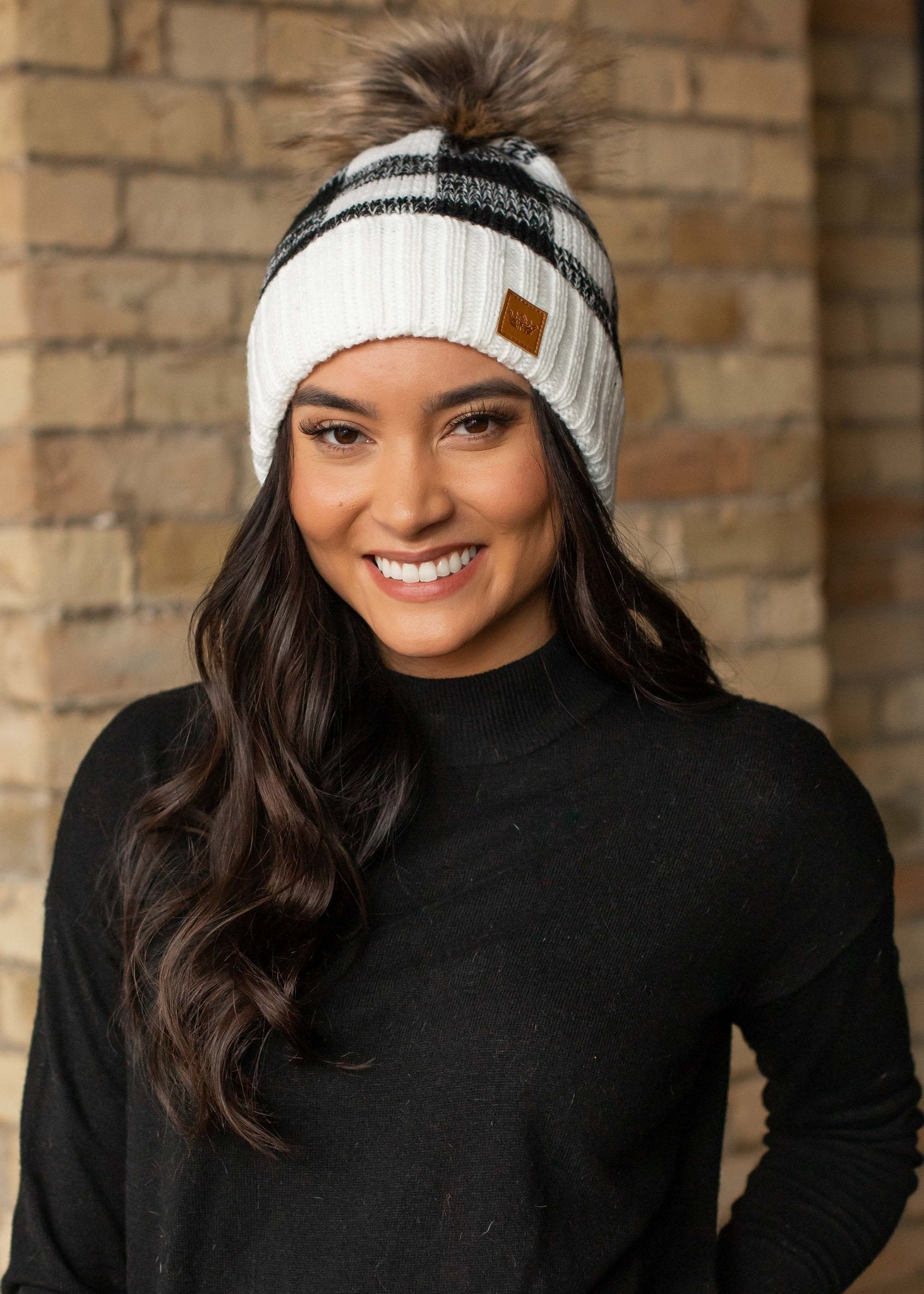 White and black buffalo plaid fleece lined knit hat with pom detail