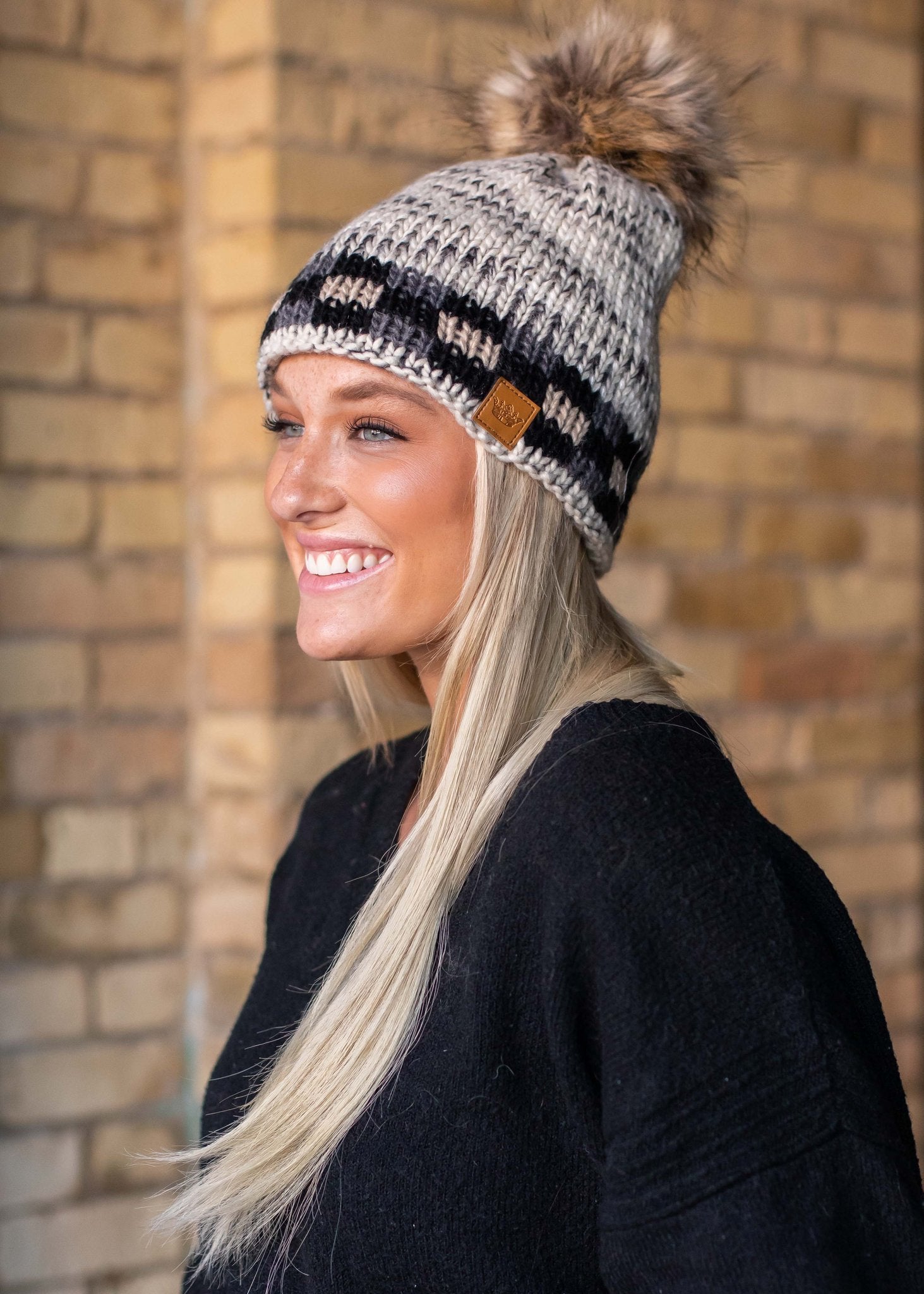 Grey heather with grey and tan buffalo plaid trim fleece lined knit hat with pom detail