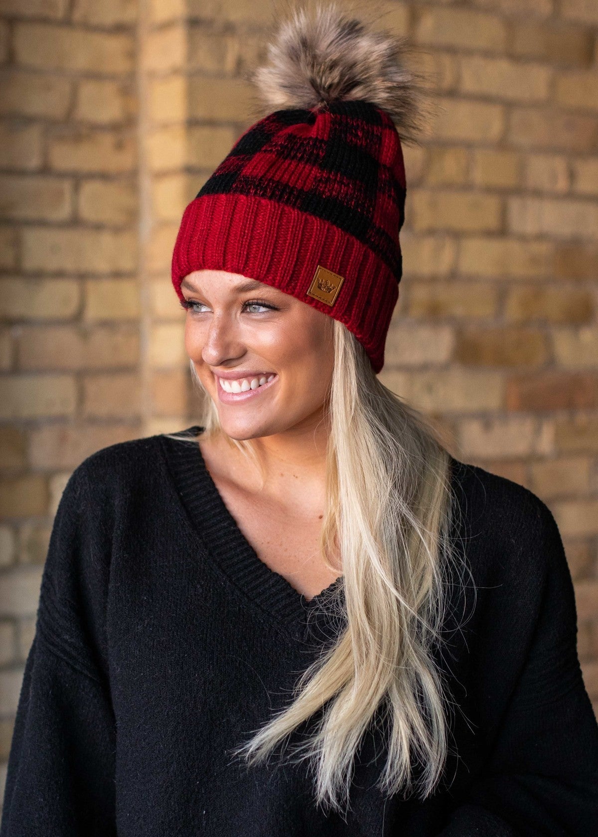 Black and red buffalo plaid fleece lined knit hat with pom accent
